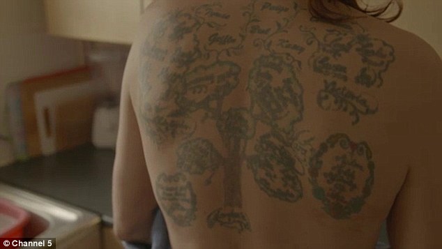Reminder: Holpin, from Ebbw Vale in Monmouthshire, south Wales, shows off his family tree tattoo - which includes his children and grandchildren