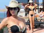 **** NOTE TO PICTURE DESK - ¬£250 FOR SET ONLINE USAGE - ¬£250 PER PIC PRINTED ***** \n Amy Childs shows off her assets on relaxing beach break - after wading in to the benefits debate ahead of the General Election next month. The former TOWIE babe hit the headlines over the weekend after she slammed benefits 'spongers' and said she is sick of paying tax for people who can't be bothered to work. Amy, 24, was snapped soaking up the rays as she relaxed around the pool last week at The Resort Group's Melia Dunas Hotel in Sal, Cape Verde. The newly-brunette beauty showed off her assets in a tiny black and cream bikini, finishing off her laid-back holiday look with a straw hat and aviator sunglasses.  SEE MERCURY COPY