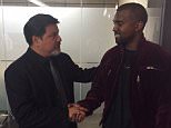 This March 2015 photo provided by courtesy of Allred, Maroko and Goldberg shows videographer Daniel Ramos, left, and Kanye West, shaking hands after West apologized to Ramos as part of a settlement, in Los Angeles. This assault case was set for trial next week on April 14, 2015, but Ramos' lawyer, Gloria Allred, filed for a dismissal on April 7, after a settlement was agreed to by both parties. One important aspect of the settlement was an apology by West to Ramos. (AP Photo/Courtesy Allred, Maroko and Goldberg)