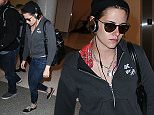 Kristen Stewart seen at LAX Airport on April 7, 2015 in Los Angeles, California, United States. \n\nPictured: Kristen Stewart\nRef: SPL994010  070415  \nPicture by: XC/PapJuice.com/Splash News\n\nSplash News and Pictures\nLos Angeles: 310-821-2666\nNew York: 212-619-2666\nLondon: 870-934-2666\nphotodesk@splashnews.com\n