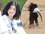 Please contact X17 before any use of these exclusive photos - x17@x17agency.com   Kylie and Kendall Jenner have a photoshoot in Malibu and in between takes talk up some bikin clad babes who look like they are fans. April 7, 2015 X17online.com