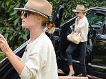 UK CLIENTS MUST CREDIT: AKM-GSI ONLY\nEXCLUSIVE: Rosie Huntington-Whiteley visits a friend on a rainy Tuesday afternoon in Los Angeles, CA on April 7, 2015. The blonde bombshell wore a beige fedora, a light cream sweater, cropped navy blue trousers and finished her ensemble with olive green designer heels.\n\nPictured: Rosie Huntington-Whiteley\nRef: SPL993849  070415   EXCLUSIVE\nPicture by: AKM-GSI / Splash News\n\n