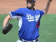 Apr 1, 2015; Surprise, AZ, USA; Los Angeles Dodgers starting pitcher Clayton Kershaw (22) pitches against the Kansas City Royals at Surprise Stadium. Mandatory Credit: Joe Camporeale-USA TODAY Sports