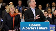 Reader says the election called by Premier Jim Prentice, seen here with wife, Karen, is a waste of money.